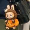 60f1c0baa0c3aaad07188d84893fbb7 LABUBU Halloween Happy Party Series - Sitting Pumpkin Vinyl Plush Pendant